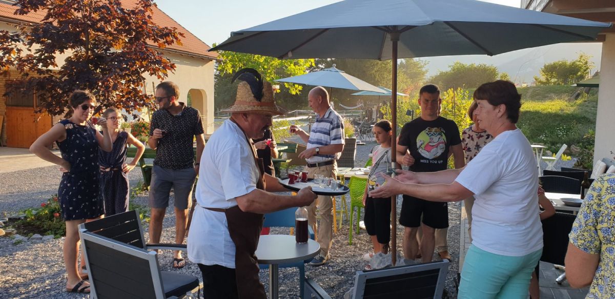 happy guests get ready to tuck into a Rihard Basa meal at the Lodge.. but first a home made apperitif!