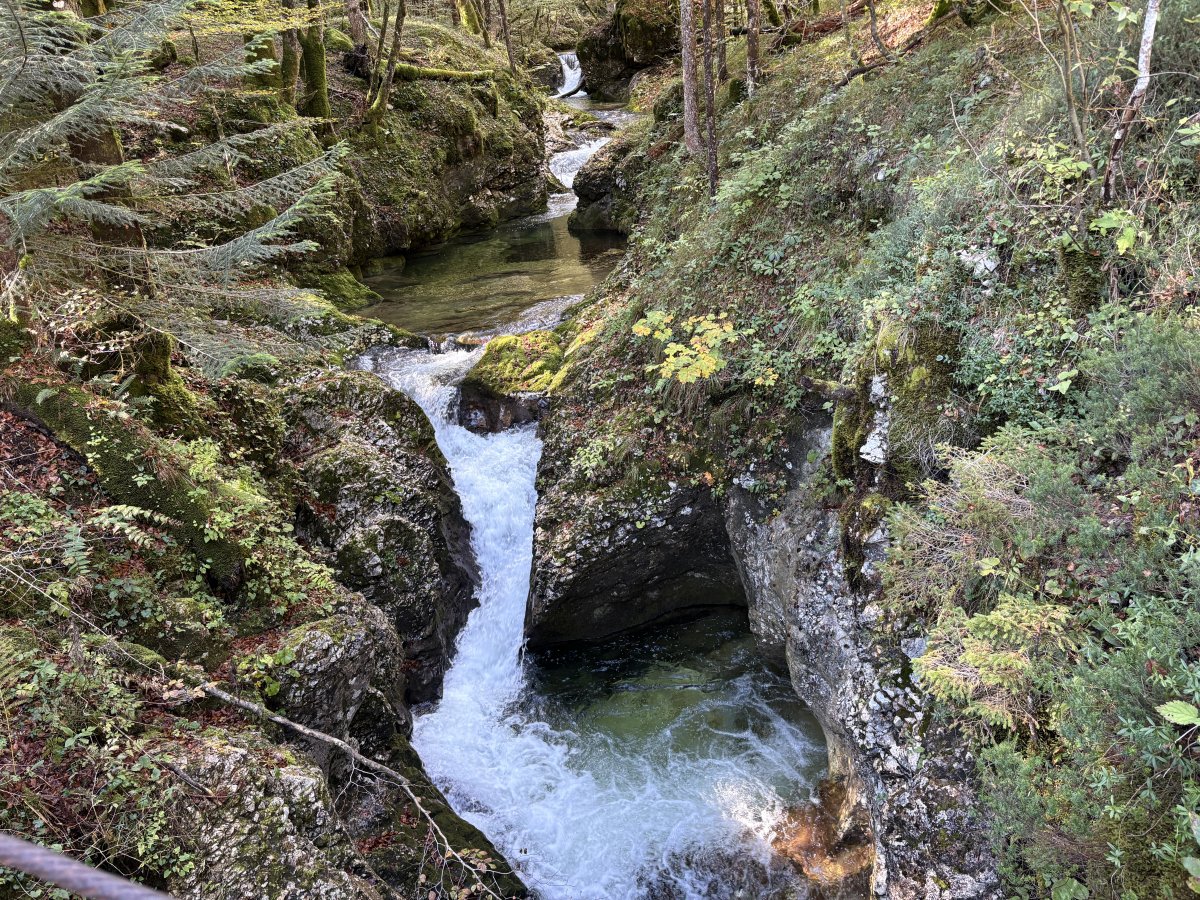 This is a stunning set of mini waterfalls along a side river flowing into the gorge, we are standing on a wooden bridge above the water.. This is a stunning set of mini waterfalls along a side river flowing into the gorge, we are standing on a wooden bridge above the water..