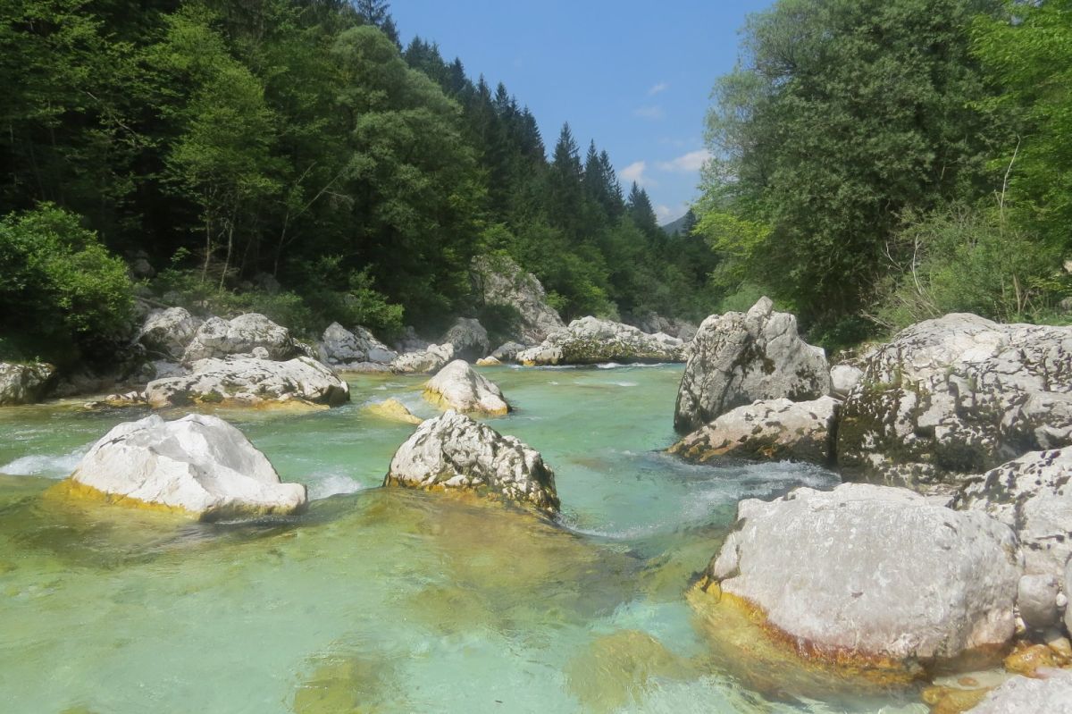 the crystal clear waer seems to slide over the white rocks in the Soca.. the crystal clear waer seems to slide over the white rocks in the Soca..