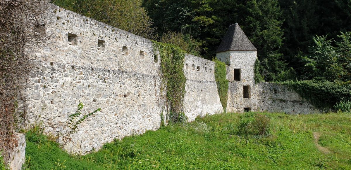 the impressive rear defensive wall with another tower in the corner.. monks lived in cells up here where the grass is now.. the impressive rear defensive wall with another tower in the corner.. monks lived in cells up here where the grass is now..