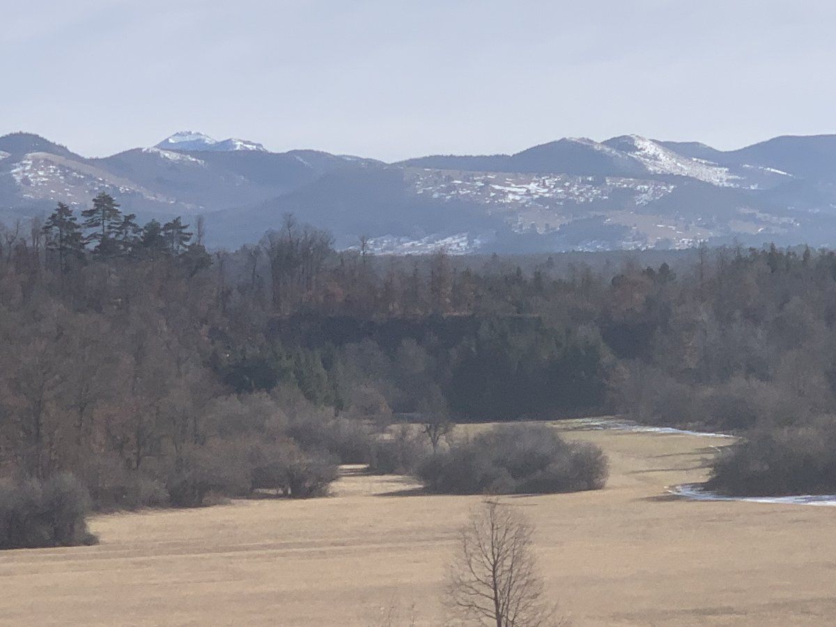 Mt Sneznik towering above the Little Drkovsce lake..