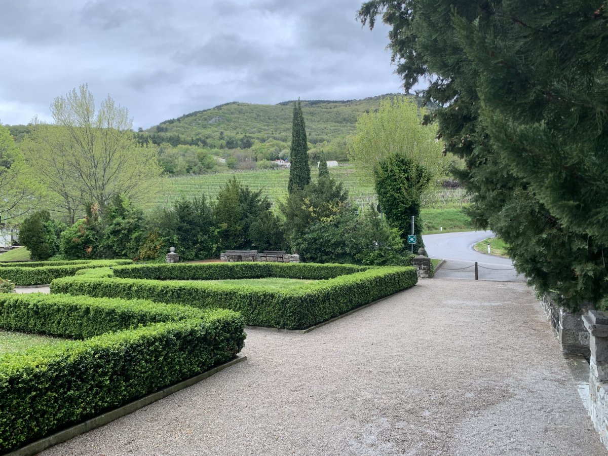 Kromberk castle gardens looking out to hills flooded with vineyards.. Kromberk castle gardens looking out to hills flooded with vineyards..