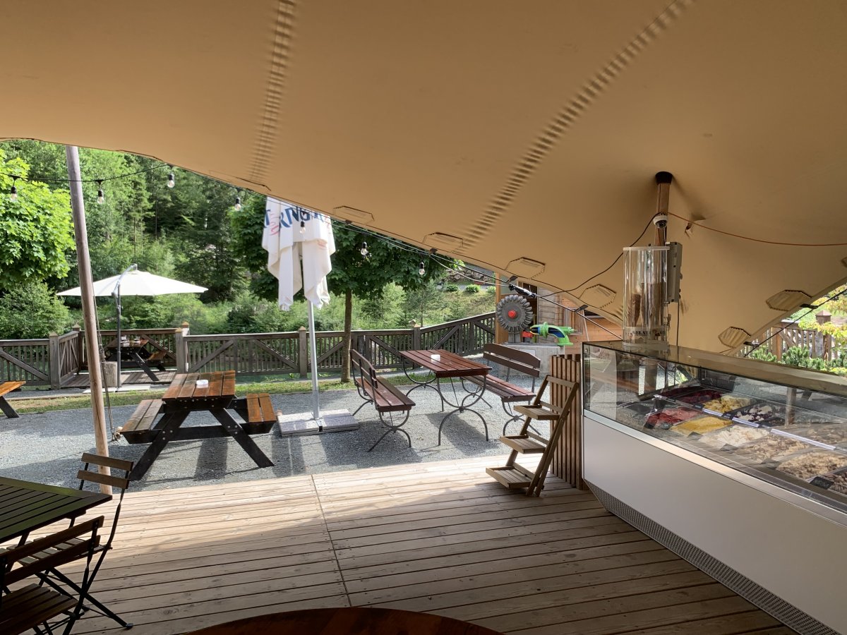 the cafe is next to the river, you can sit above the water.. the cafe is next to the river, you can sit above the water..