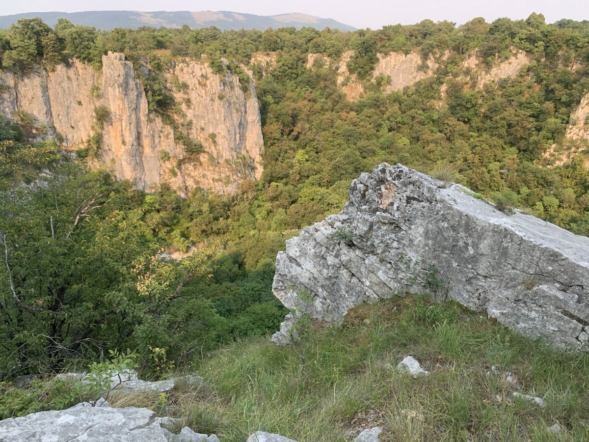 the massive Dragon's Crater sits at the base of the Red Karst.. the massive Dragon's Crater sits at the base of the Red Karst..