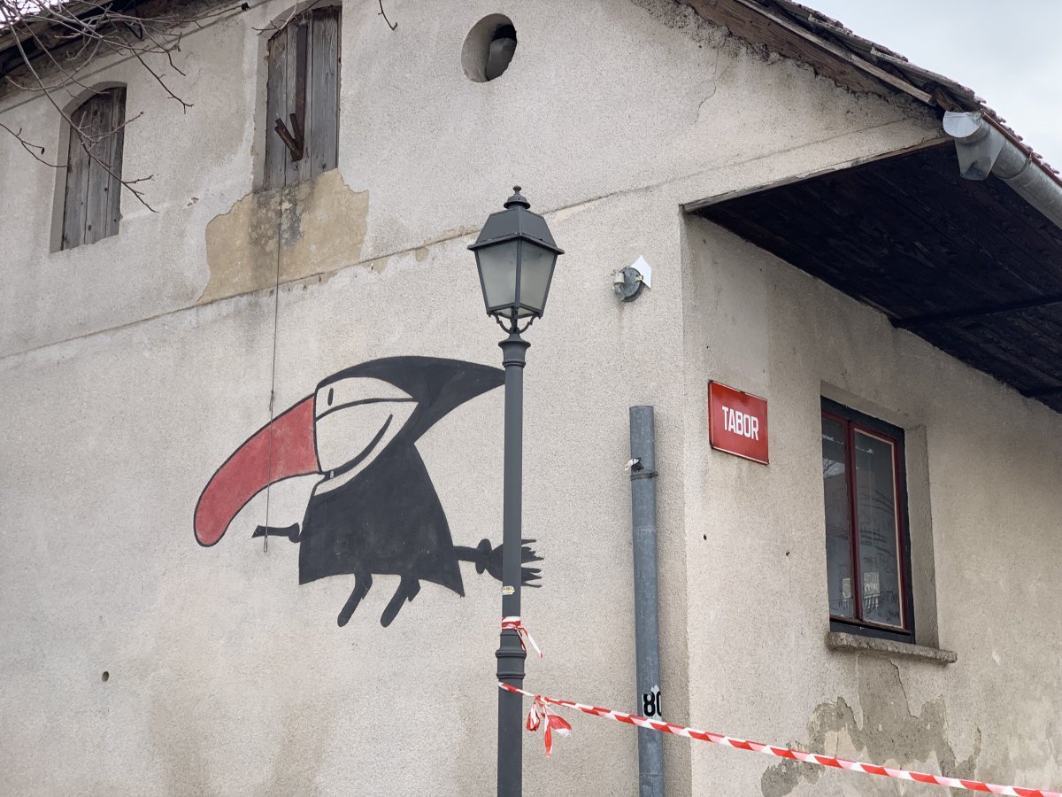 Ursula the witch is painted onto the side of a house in Cerknica..