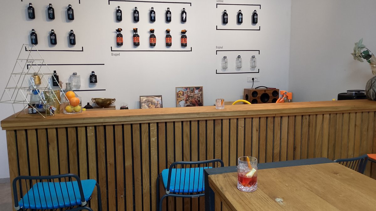 A glass of home made Brkini Gin and the bar at Brin Gin, Rodik.. A glass of home made Brkini Gin and the bar at Brin Gin, Rodik..