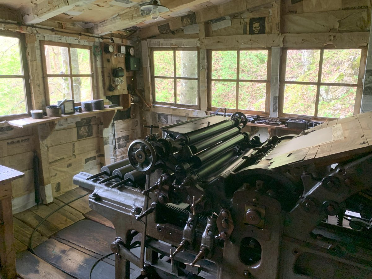 This WW2 printing press still works and is hidden in the forest on the side of a mountain.. This WW2 printing press still works and is hidden in the forest on the side of a mountain..
