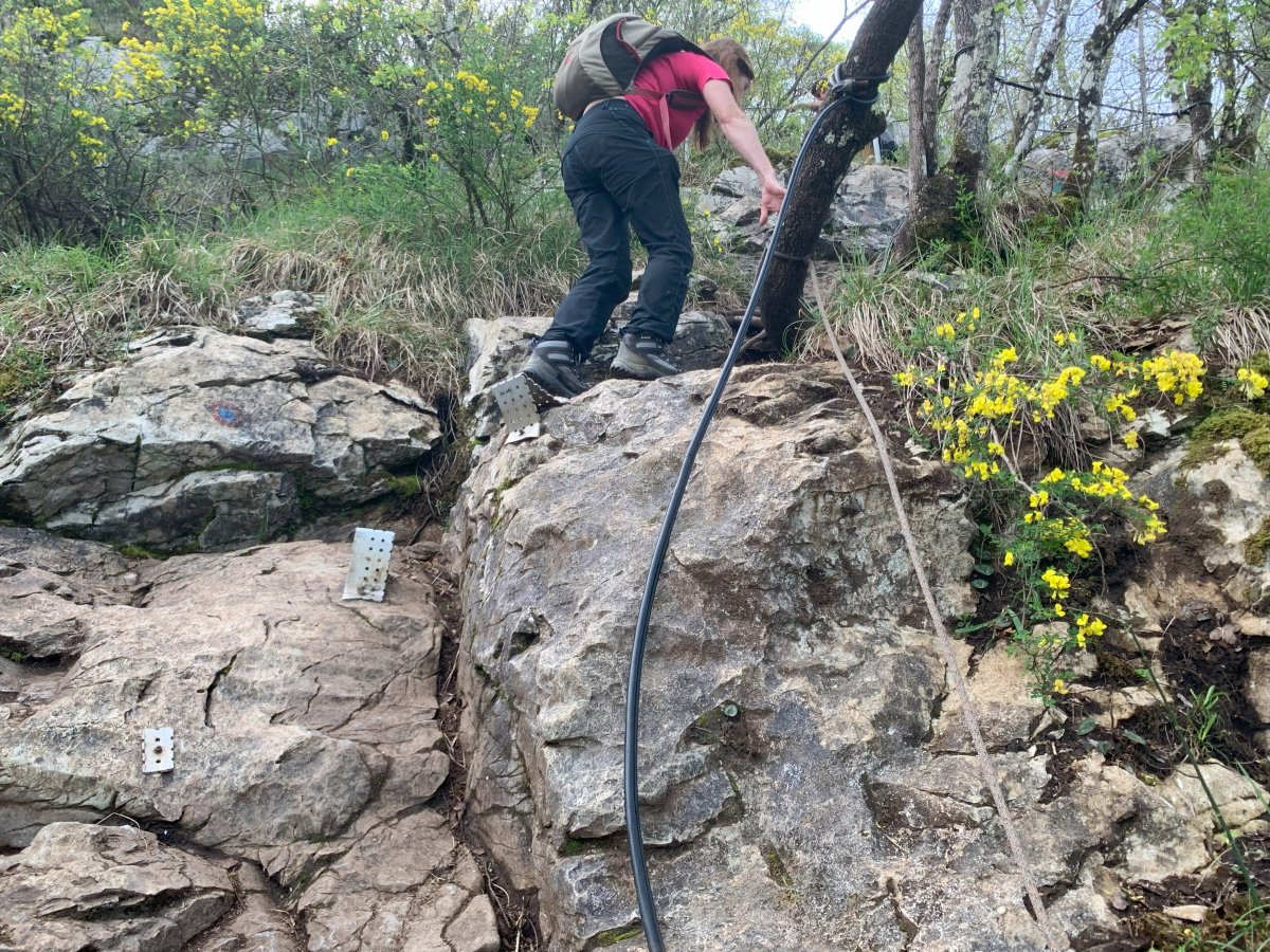 This is probably the scariest bit, where you have to pull yourself up the rock face, using the metal footholds, but it is a very short section.. This is probably the scariest bit, where you have to pull yourself up the rock face, using the metal footholds, but it is a very short section..