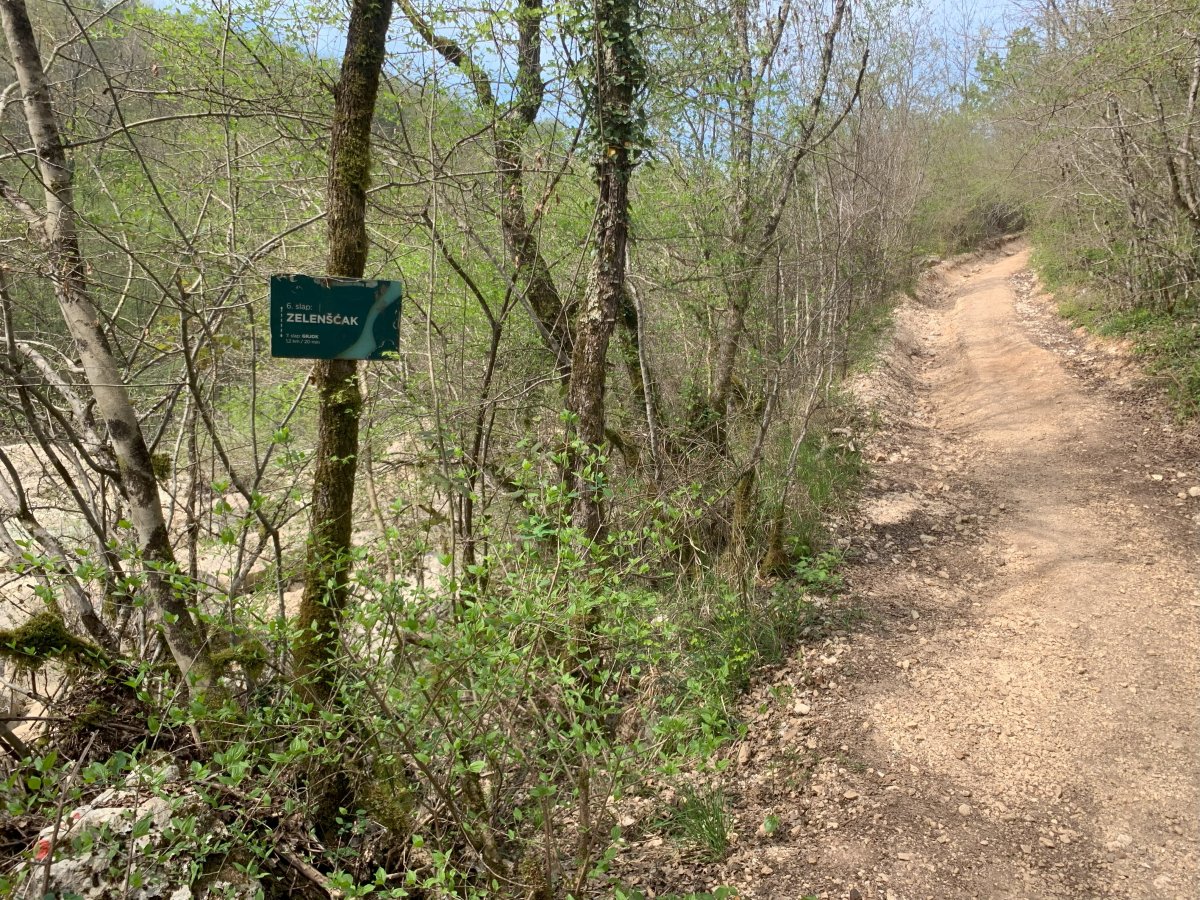 This sign is handy as you might not know to go explore by the river here to find the stunning waterfall that awaits you.. This sign is handy as you might not know to go explore by the river here to find the stunning waterfall that awaits you..