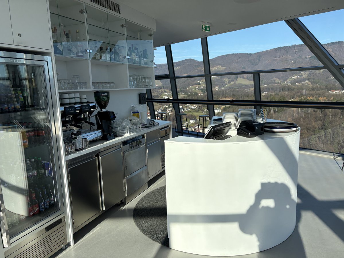 Modern cafe with plenty of tables inside at the top of the tower.. Modern cafe with plenty of tables inside at the top of the tower..