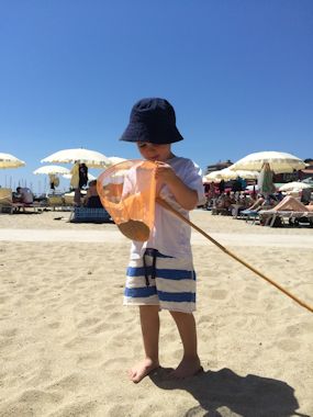 kid on beach in slovenia