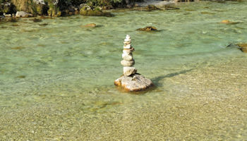 rock statue in the soca river